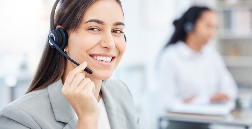 Shot of a young female call center agent working in an office